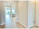 Open-concept floor plan with living room, kitchen and outdoor view at 10275 Park Estates Ave, Orlando, FL 32836