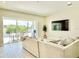 Bright living room featuring a large sliding glass door leading to an outdoor dining area at 10275 Park Estates Ave, Orlando, FL 32836