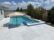 Backyard pool with an attached spa, and a large patio area for summer relaxation at 10275 Park Estates Ave, Orlando, FL 32836