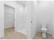 This bright bathroom features a glass shower with luxurious tile, and a modern toilet at 104 Alta Vista Way, Davenport, FL 33837