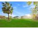 New construction homes on large lot with expansive green lawn and blue skies at 104 Alta Vista Way, Davenport, FL 33837