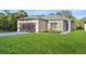 Charming single-story home featuring a well-maintained lawn and neutral-colored exterior at 104 Alta Vista Way, Davenport, FL 33837