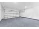 Clean garage featuring light gray paint and a light-colored floor at 104 Alta Vista Way, Davenport, FL 33837