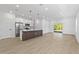 Open concept kitchen featuring island with quartz countertop, and stainless steel appliances at 104 Alta Vista Way, Davenport, FL 33837