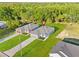 Aerial view of a single-story home with a two-car garage, front yard, and green space at 108 Alta Vista Way, Davenport, FL 33837