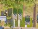 Aerial view highlighting property lines, houses, driveways, and greenery with many trees in the area at 108 Alta Vista Way, Davenport, FL 33837