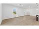 Spacious living room with bright windows and wood-look flooring, perfect for entertaining and relaxation at 108 Alta Vista Way, Davenport, FL 33837
