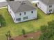 Aerial view of a home with a spacious yard and an attractive neighborhood layout at 1169 Happy Forest Loop, Deland, FL 32720