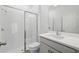 Well-lit bathroom with a glass-enclosed shower and a vanity with white countertop at 1169 Happy Forest Loop, Deland, FL 32720