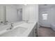 Bathroom featuring double sinks with a white quartz countertop and a full vanity mirror at 1169 Happy Forest Loop, Deland, FL 32720