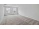 Spacious bedroom featuring plush carpet and two windows providing plenty of natural light at 1169 Happy Forest Loop, Deland, FL 32720