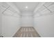 Walk-in closet with carpet flooring, lighting, and shelving ready for organizing at 1169 Happy Forest Loop, Deland, FL 32720