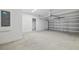 Clean, well-lit garage with a high ceiling and ample space for parking at 1169 Happy Forest Loop, Deland, FL 32720