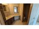 Bathroom features a classic vanity, mirror, toilet, and vintage wallpaper at 1275 Arapaho Trl, Geneva, FL 32732