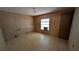 Bedroom featuring a window with an air conditioning unit and a door at 1275 Arapaho Trl, Geneva, FL 32732