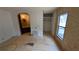 Room featuring an open closet, window, and adjacent bathroom area at 1275 Arapaho Trl, Geneva, FL 32732