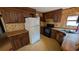 Functional kitchen featuring a refrigerator, oven, and a stainless steel sink at 1275 Arapaho Trl, Geneva, FL 32732