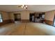 Spacious living room showing an open floor plan and breakfast bar at 1275 Arapaho Trl, Geneva, FL 32732