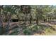 Heavily wooded lot with a small covered structure in the background at 1275 Arapaho Trl, Geneva, FL 32732