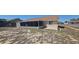 Spacious backyard featuring a screened porch, a small patio area, and partial fencing at 129 Valentino Ct, Davenport, FL 33837