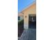 Home exterior shows a garage entrance and yard area, under a bright, clear sky at 129 Valentino Ct, Davenport, FL 33837