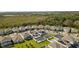 Drone shot showing the home in a community with pools, landscaping, and nature views at 13242 Orange Isle Dr, Windermere, FL 34786