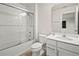 Clean bathroom with a glass-enclosed shower, white vanity, and modern fixtures at 13242 Orange Isle Dr, Windermere, FL 34786
