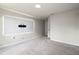 Spacious bedroom featuring a wall with a media center and carpet at 13242 Orange Isle Dr, Windermere, FL 34786