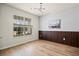 Bedroom boasting wood floors, a large window, and modern wall accents at 13242 Orange Isle Dr, Windermere, FL 34786