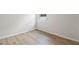 Cozy room featuring hardwood floors, neutral walls, and a bright window at 13242 Orange Isle Dr, Windermere, FL 34786