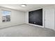 Bright bedroom featuring modern wall decor, plush carpet, and a large window for natural light at 13242 Orange Isle Dr, Windermere, FL 34786