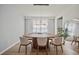 Dining room featuring a modern light fixture, oval table and wood floors at 13242 Orange Isle Dr, Windermere, FL 34786