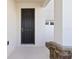 Front entrance of home featuring a covered porch and stone accent base at 13242 Orange Isle Dr, Windermere, FL 34786