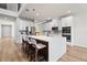 Modern kitchen featuring white cabinets, stainless steel appliances, and a stylish island with bar seating at 13242 Orange Isle Dr, Windermere, FL 34786