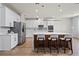 Bright kitchen with modern appliances, a large island with seating, and sleek countertops at 13242 Orange Isle Dr, Windermere, FL 34786