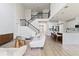 Bright and airy living room showcasing an open floor plan and modern staircase at 13242 Orange Isle Dr, Windermere, FL 34786