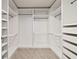 White walk-in closet featuring shelving and drawers at 13242 Orange Isle Dr, Windermere, FL 34786