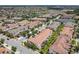 An aerial view captures the property's location in the community, showcasing nearby ponds, recreation and businesses at 14014 Millington St, Orlando, FL 32832
