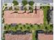 Aerial view showcases the community layout, including tile roofs, landscaping, and parking areas at 14014 Millington St, Orlando, FL 32832