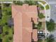 An overhead image reveals the meticulously maintained landscape and roof of the property, providing a bird's-eye perspective at 14014 Millington St, Orlando, FL 32832
