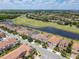 Beautiful aerial view of homes situated along a serene pond and golf course at 14014 Millington St, Orlando, FL 32832