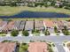 An aerial view shows the property's location, nearby golf course and pond, along with the surrounding community at 14014 Millington St, Orlando, FL 32832