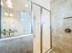 Bathroom features a tiled shower and a vanity with granite countertops at 14014 Millington St, Orlando, FL 32832