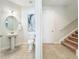 Half-bathroom with a modern pedestal sink and tile flooring at 14014 Millington St, Orlando, FL 32832