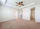 Spacious bedroom with tray ceiling, carpet, and neutral walls at 14014 Millington St, Orlando, FL 32832