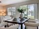 Dining room features a table set for six with view to the backyard at 14014 Millington St, Orlando, FL 32832