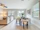 Bright dining room features a dining table, a large window, and a view of the backyard at 14014 Millington St, Orlando, FL 32832