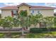 Charming two-story home with red shutters, a tile roof, and well-maintained landscaping at 14014 Millington St, Orlando, FL 32832