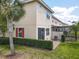 The rear exterior features a patio, sliding glass door, privacy fence and lush landscaping at 14014 Millington St, Orlando, FL 32832