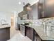 Well-equipped kitchen with stainless steel appliances, granite countertops, and a decorative backsplash at 14014 Millington St, Orlando, FL 32832